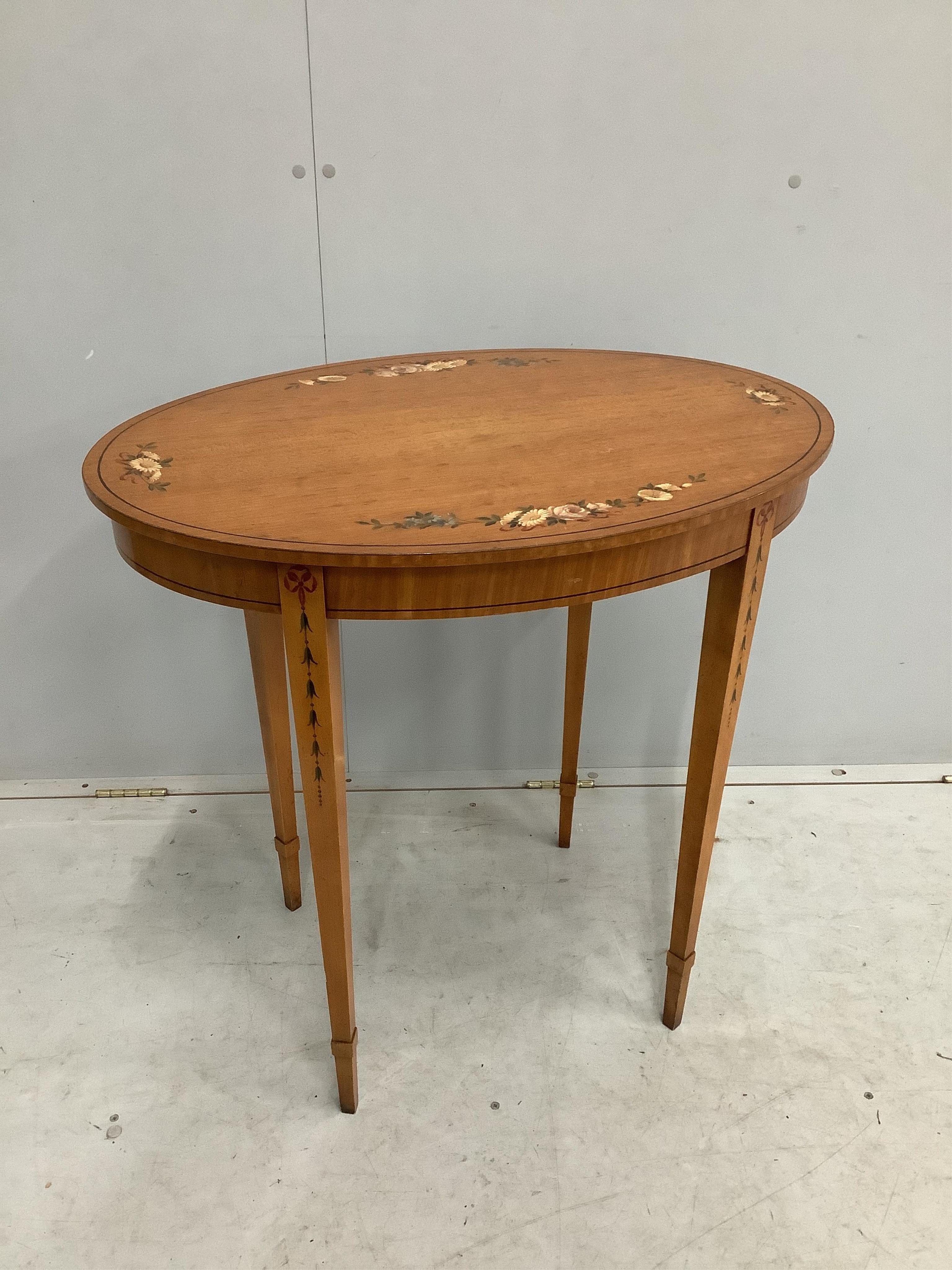 A pair of reproduction Sheraton style painted oval satinwood occasional tables, width 74cm, depth 52cm, height 74cm. Condition - good